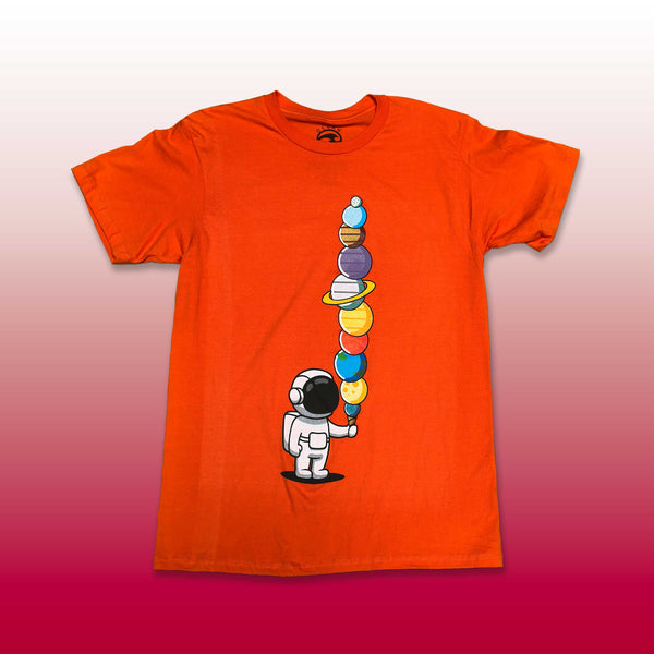 Custom screen printed orange t-shirt with astronaut stacking planets cartoon