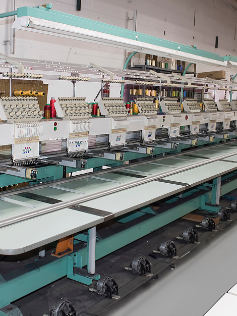 Row of industrial embroidery machines in fernandos screen printing