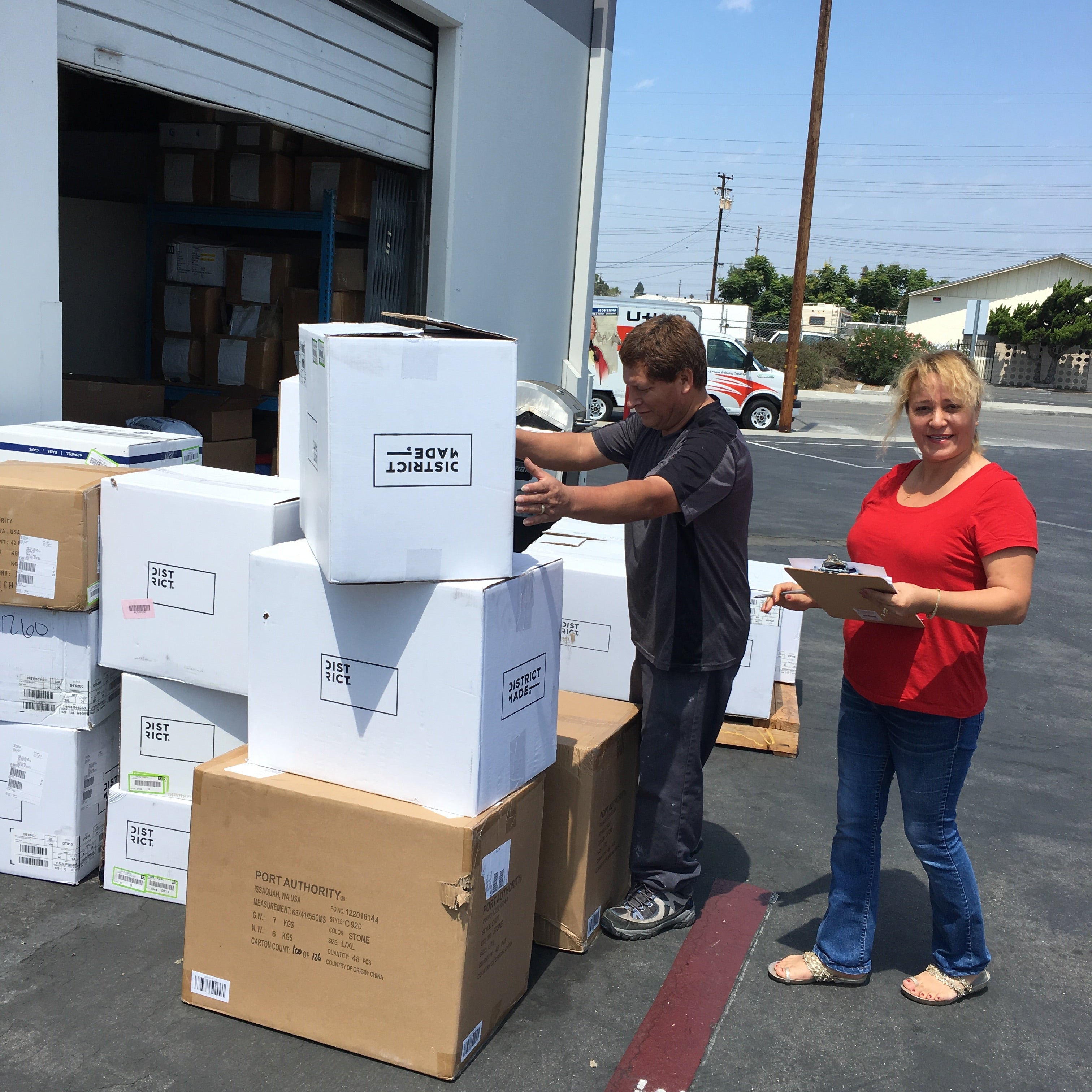 Daniel Campero unloading boxes from a truck in an outdoor setting.